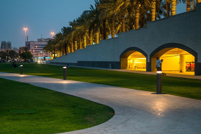 Illuminated building against sky