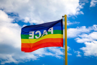 Low angle view of flag against sky