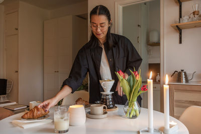 Woman preparing coffee