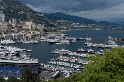 High angle view of harbor and buildings in city