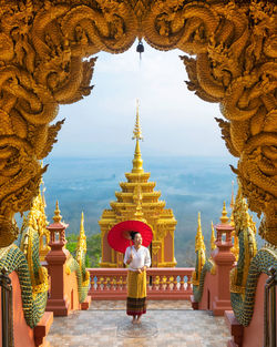 Statue of temple outside building