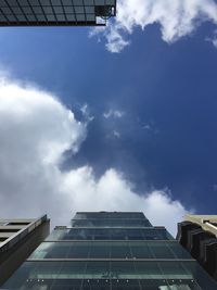 Low angle view of building against cloudy sky