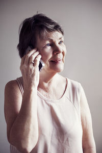 Senior woman talking via phone