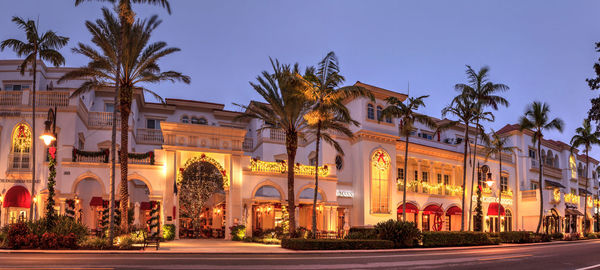 Christmas lights as sunrises over the french restaurant along 5th street in old naples, florida.