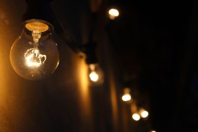 Close-up of illuminated light bulb