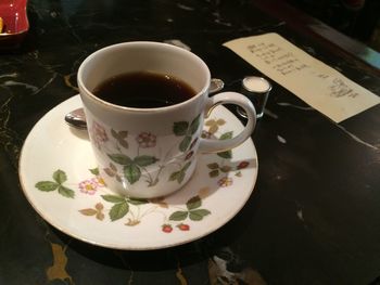 Close-up of coffee cup on table