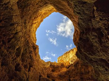 Looking up through a natural hole  off the algarve coast 