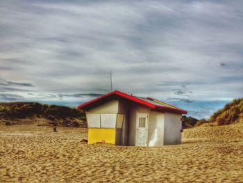 Built structure against cloudy sky