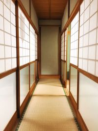 Empty corridor of building with japanese sliding door and tatami mat