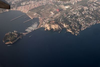 High angle view of city lit up at night