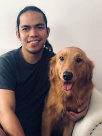 Portrait of smiling young woman with dog