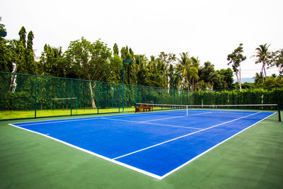 Outdoor blue ground tennis court