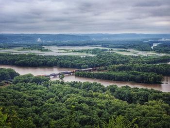 Scenic view of landscape against cloudy sky