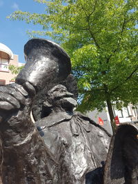 Low angle view of statue against sky