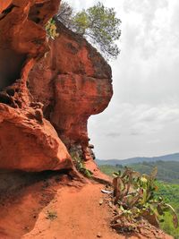 Rock formations on landscape against sky