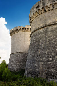 Low angle view of fort against sky