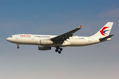 Low angle view of airplane against clear sky