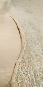 High angle view of surf on beach