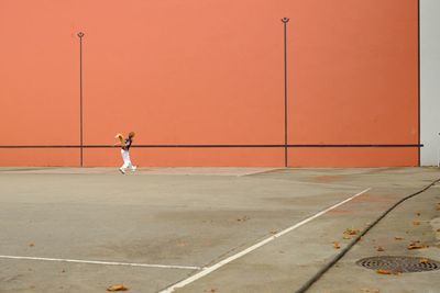 Man playing jai alai in court