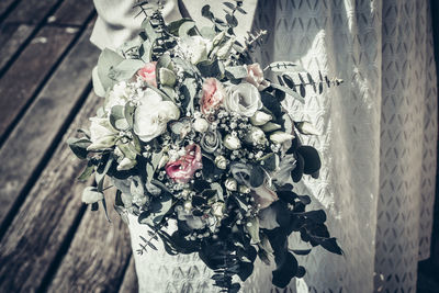 High angle view of rose bouquet on wood