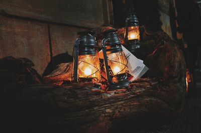 Close-up of illuminated lantern on table