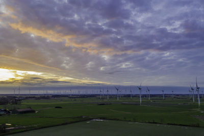 Scenic view of field against sky during sunset