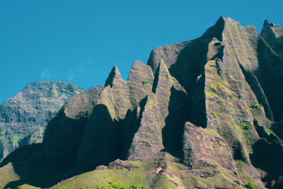 Low angle view of rock formation against sky