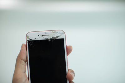 Close-up of person holding mobile phone