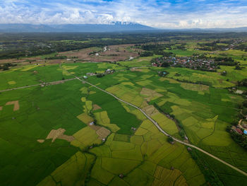 Aerial view of landscape against cloudy sky