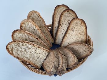 High angle view of bread on table against white background