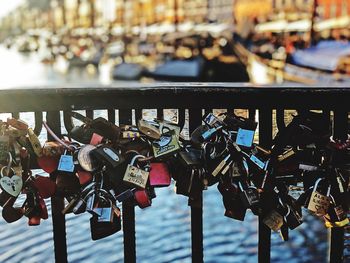 Padlocks on bridge railing