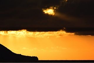 Scenic view of dramatic sky at sunset