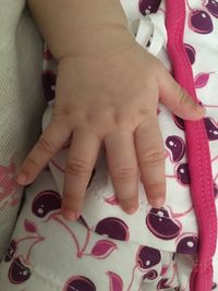High angle view of baby hands