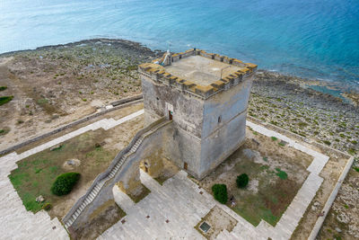 High angle view of cityscape by sea