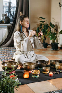 Young woman sitting at home