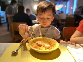 Close-up of boy eating food