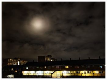 Buildings in city at night