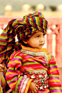 Close-up of cute boy looking away