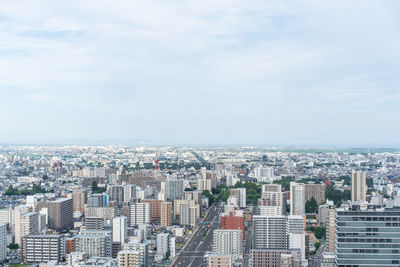 High angle view of buildings against sky in city