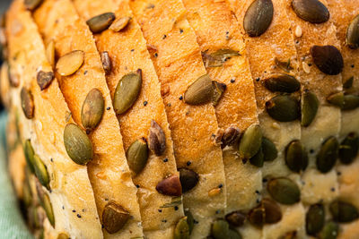 Detail of seeded sliced white bread with pumpkin seeds, sunflower seeds, sesame seeds, poppy seeds