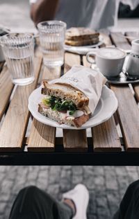 High angle view of breakfast served on table in restaurant, bread with eggs.