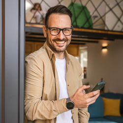 Portrait of young man using mobile phone