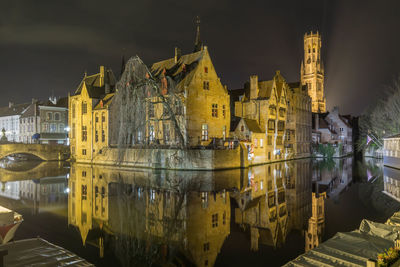 Illuminated buildings in city at night