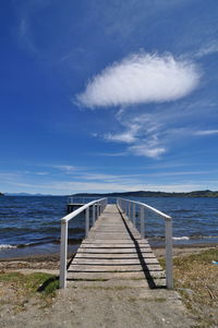 Pier over sea against sky