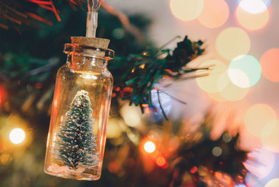 Close-up of illuminated christmas decorations on table