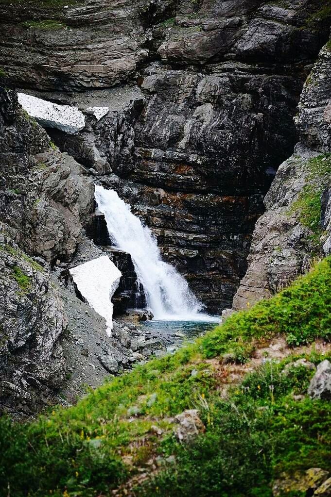 WATER FLOWING FROM WATERFALL