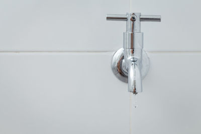 Close-up of faucet on wall