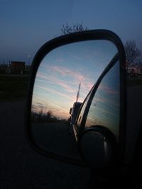 Reflection of car on side-view mirror