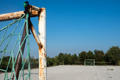 Playground against clear blue sky