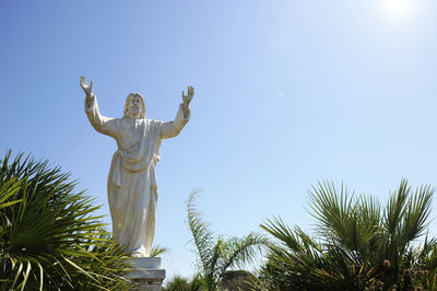 Low angle view of statue against sky